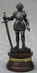 This miniature Italian medieval pewter knight figure is one from our fine collection of miniature pewter knights. This knight is actually MADE IN ITALY! All Italian made knights are represented with a choice medieval weapon and clad in the classic historical armor styles of medieval Europe.