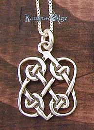 Sterling Silver Celtic Love Knot. Two Hearts entwined in silver celtic knots. 5/8" wide